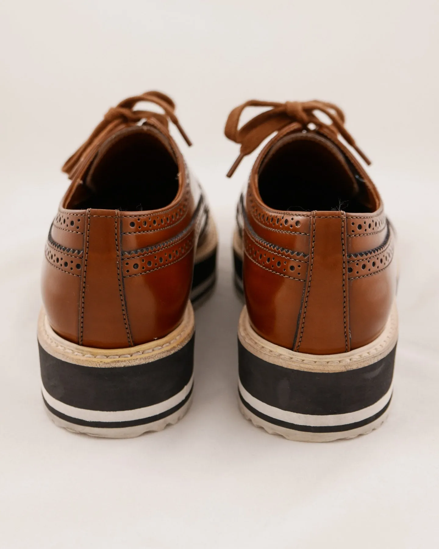 Prada Leather Wingtip Platform Shoes
